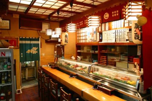 a fast food restaurant with a counter with food at Seisenso in Nozawa Onsen
