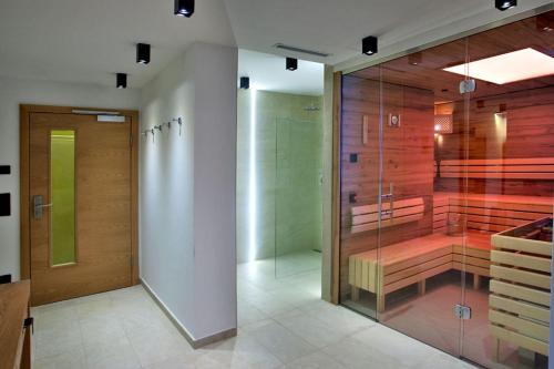 a bathroom with a walk in shower and a glass wall at Mountain Vita in Obertauern