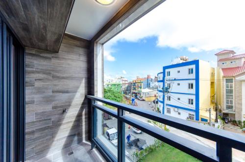 a balcony with a view of a city at The Lin Inn in Kenting