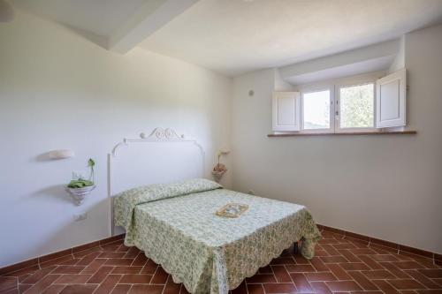 Una cama o camas en una habitación de Agriturismo Sant Elmira - Relax with external Jacuzzi