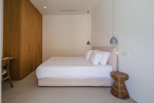 Ένα ή περισσότερα κρεβάτια σε δωμάτιο στο Amarelo Suites