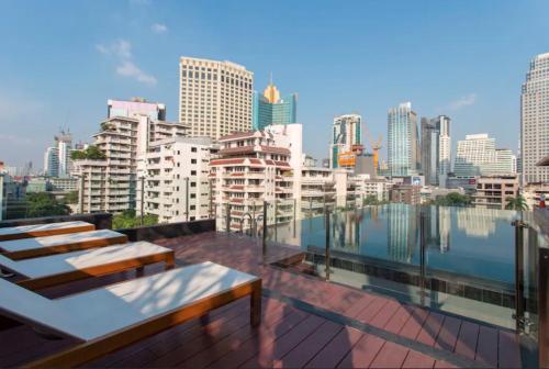 a balcony with a view of a city skyline at Bangkok Asok Circle REIN Sukhumvit 12#2BR&3BR#Pool&Gym#Near Terminal 21 in Bangkok
