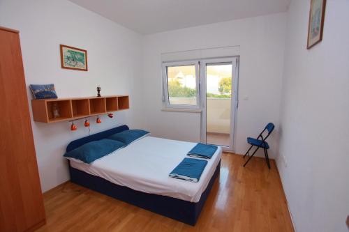 Ένα ή περισσότερα κρεβάτια σε δωμάτιο στο Apartments A&G