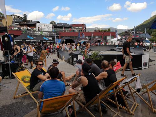 a group of people sitting in chairs at a concert at Hotel Pinzgauerhof - Inclusive Evening Dinner in Saalbach Hinterglemm