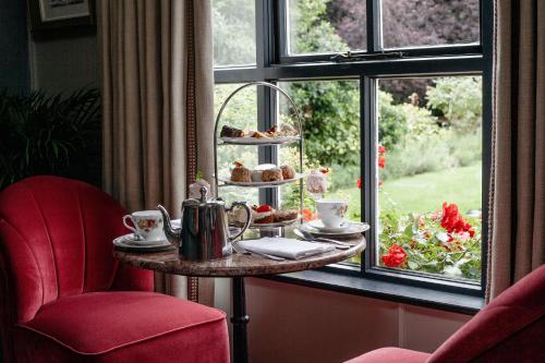 a table with pastries on it next to a window at The Station House Hotel in Kilmessan