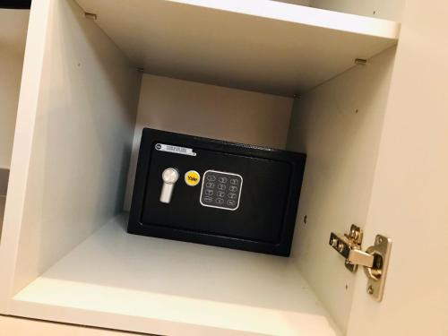 a door with a control panel in a room at Agathè Luxury Bed and Breakfast in Marina di Schiavonea
