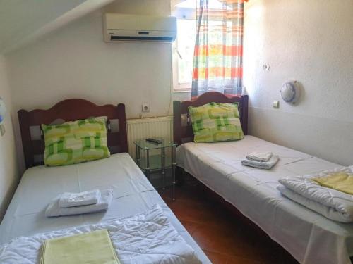 Cama ou camas em um quarto em Hotel Asikot