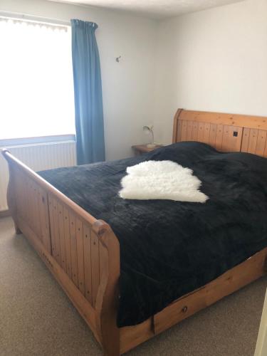 Een bed of bedden in een kamer bij Appartement De Brink
