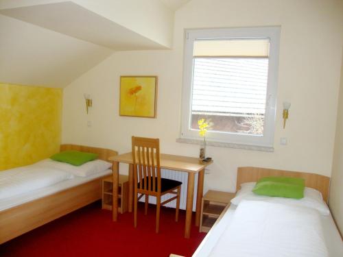 En eller flere senge i et værelse på Krämerwirt Hotel-Gasthof