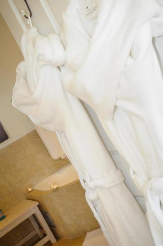 a white statue of a woman sitting on a stairs at La Vista Lodge in Plettenberg Bay
