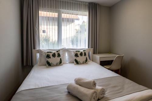 Katil atau katil-katil dalam bilik di TheHouse - Apartment Kamenitza