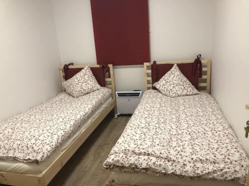 two twin beds in a room with at Vacation house in Saulkrasti