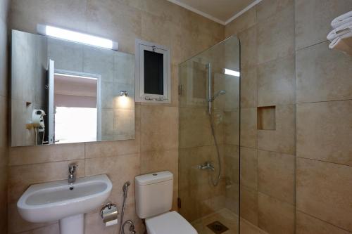 a bathroom with a toilet and a sink and a shower at Zoukotel Hotel in Jounieh