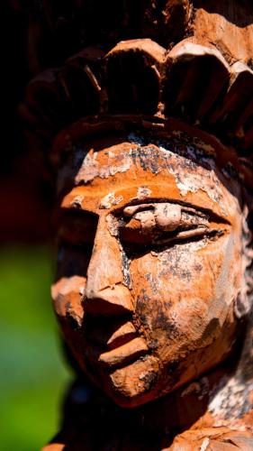 a face carved into the side of a statue at Serenity Luxury Villa, Skiathos in Agia Paraskevi