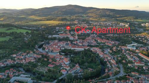 an aerial view of a city with a red sign that reads oak apartment at CK-Apartment in Český Krumlov