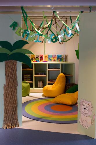 a childs room with a play area with a tree at Columbia Beach Resort in Pissouri