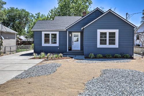 a blue house with a gravel driveway at Hot Tub, Fire Pit Midtown Reno Oasis! in Reno