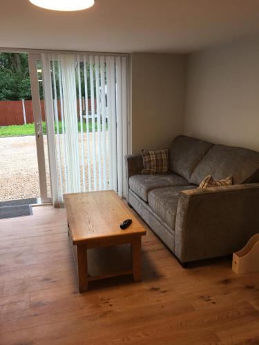 a living room with a couch and a coffee table at MOD’s place in Nenagh