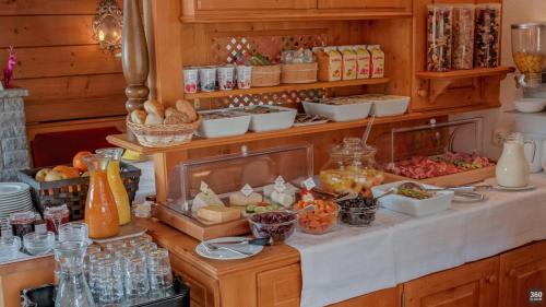 a buffet of food on a counter in a kitchen at Haus Schrofenstein in Lech am Arlberg