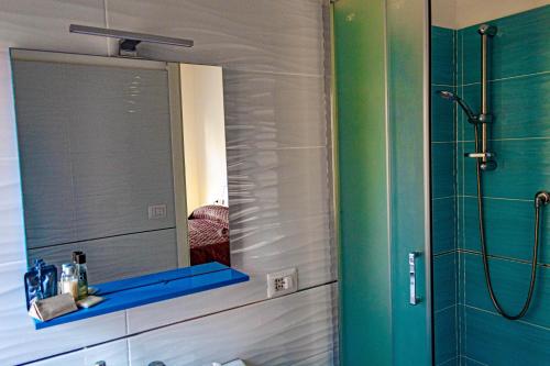 a bathroom with a mirror and a shower at Bed end Breakfast Mediterraneo in Scalea