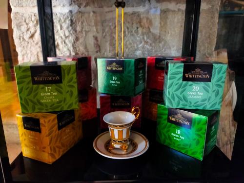 a group of tea bags and a cup on a table at Antica Taverna del Principe in Sepino