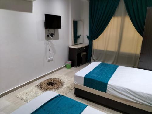 One Bedroom Suite with Aqua View at Mirage Bay Resort房間的床