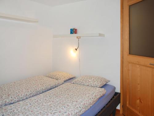 Postel nebo postele na pokoji v ubytování Holiday Home Rustico Enrico by Interhome