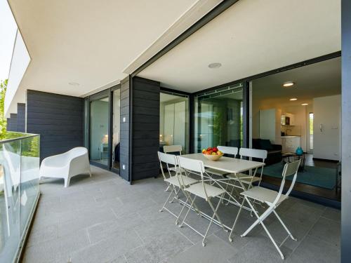 a dining room with a table and chairs at Apartment Fűzfő by Interhome in Balatonszemes