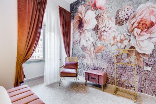 a bedroom with a floral mural on the wall at Trevi Fountain - NEW! - Your Italian Holidays in Rome