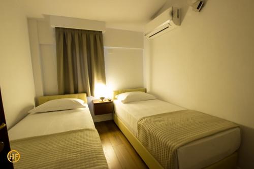 Ένα ή περισσότερα κρεβάτια σε δωμάτιο στο Hotel Fantasy