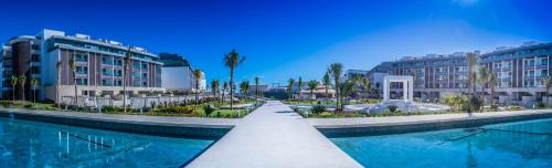 a resort with a swimming pool and some buildings at Majestic Elegance Costa Mujeres - All Inclusive in Cancún