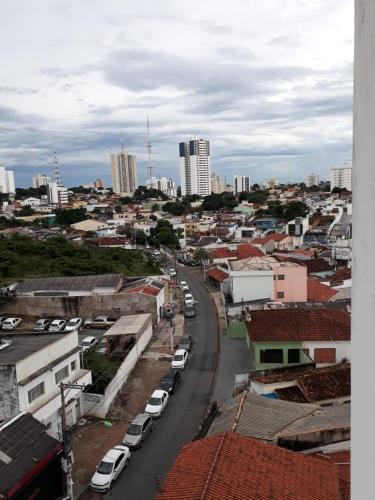 a view of a city with cars parked on a street at no centro de Cuiabá aptº mobiliado in Cuiabá