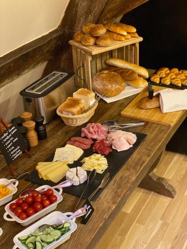 a table topped with lots of different types of food at Zámecký hotel & Wellness in Poděbrady