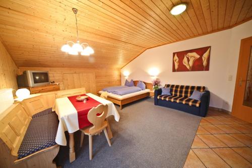 a living room with a couch and a table at Haus Plattenkar in Obertauern