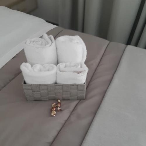 a pile of towels sitting on a table at Rainbow Sweet Rooms in Valmontone
