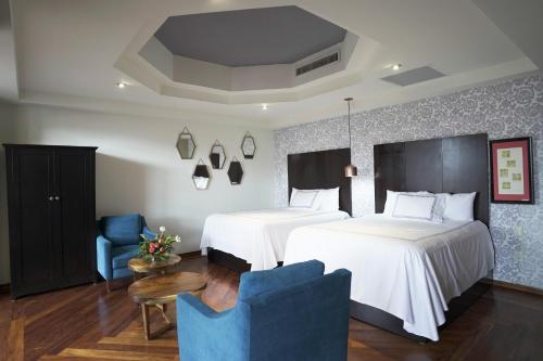 Katil atau katil-katil dalam bilik di Santa Rita Hotel del Arte