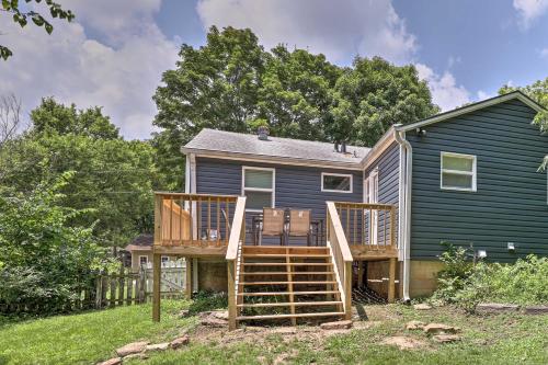 a home with a deck and a house at Updated Fayetteville Home Less Than 2 Miles to UArk! in Fayetteville
