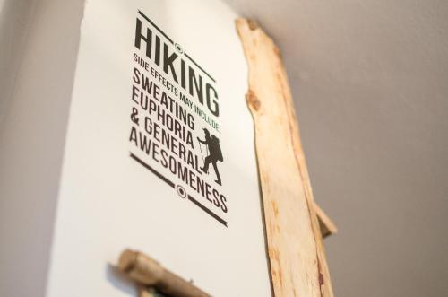 a surfboard with a sign on top of it at Rustic Home Tara in Kaludjerske Bare