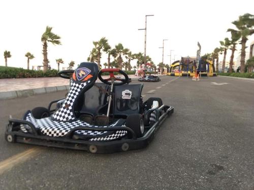 a childs race car on the road in the street at porto said بورتوسعيد in `Ezbet Shalabi el-Rûdi