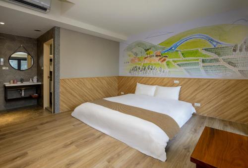 Ein Bett oder Betten in einem Zimmer der Unterkunft 秘境四一民宿桃園市民宿109號