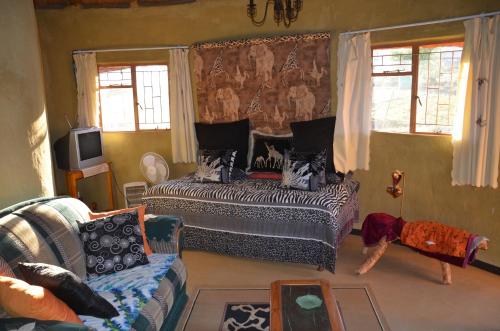 Säng eller sängar i ett rum på Bama Lodge