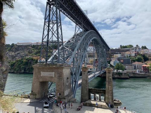 
a bridge over a body of water at Fabrica Apart in Porto
