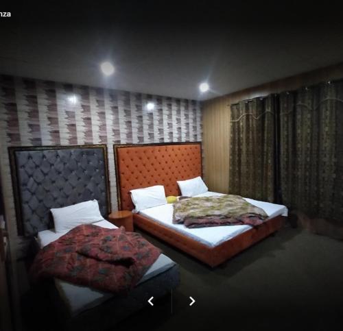 Postel nebo postele na pokoji v ubytování Arcadian Inn Hotel