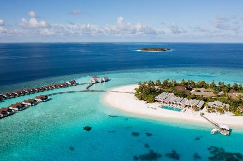 an aerial view of an island in the ocean at The Standard, Huruvalhi Maldives in Raa Atoll