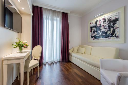 TV a/nebo společenská místnost v ubytování Trilussa Palace Hotel Congress & Spa