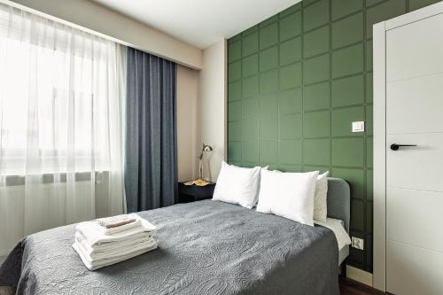 Ένα ή περισσότερα κρεβάτια σε δωμάτιο στο Aparthotel Plac Litewski Premium