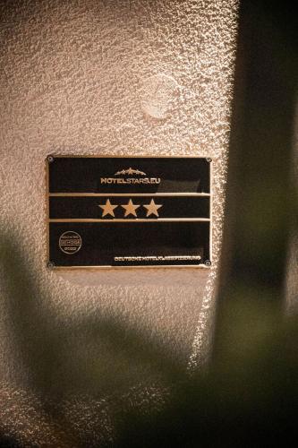a box with stars on it sitting on a wall at Rossano Boutique Hotel & Ristorante in Ansbach
