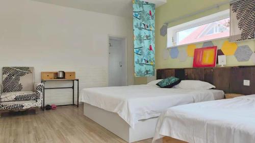 Postel nebo postele na pokoji v ubytování July Inn Weihai