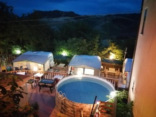 a view of a swimming pool at night at Parco Gessilandia in Sassofeltrio