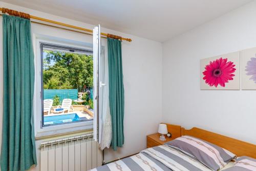Voodi või voodid majutusasutuse Apartments Vanessa with Shared Pool toas